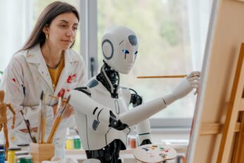 A woman teaching art to a robot, symbolizing the fusion of creativity and artificial intelligence in education.