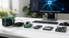 AI hardware boards including NVIDIA Jetson, Raspberry Pi 5, and Google Coral arranged on a modern makerspace desk with Mac Studio in background