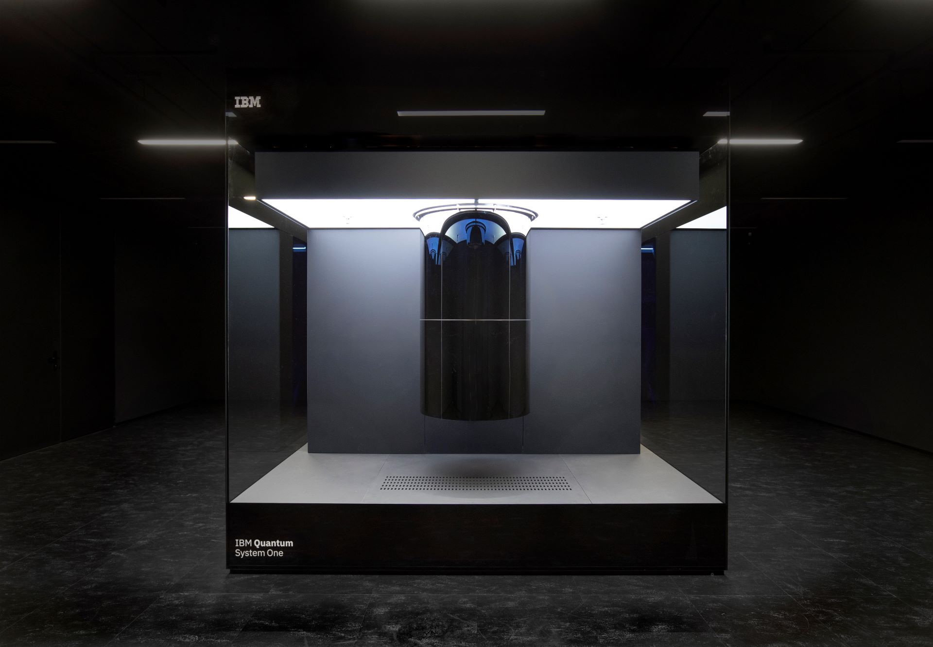 IBM Quantum System One quantum computer enclosed in a glass cube at a research facility in Ehningen, Germany